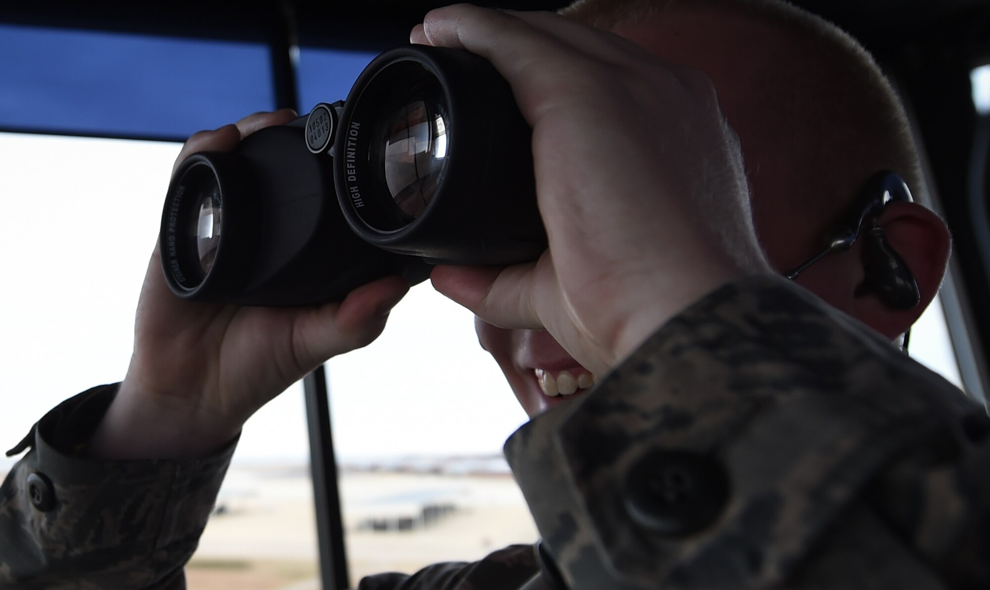 U.S. Air Force Senior Airman Patrick Taylor, 1st Operations Support Squadron air traffic controller, watches airfield traffic at Joint Base Langley-Eustis, Va., Dec. 16, 2016. The control tower supports the 1st Fighter Wing in addition to NASA, transient aircraft, Fort Eustis and distinguished visitor aircraft flying missions. (U.S. Air Force photo by Staff Sgt. Natasha Stannard)