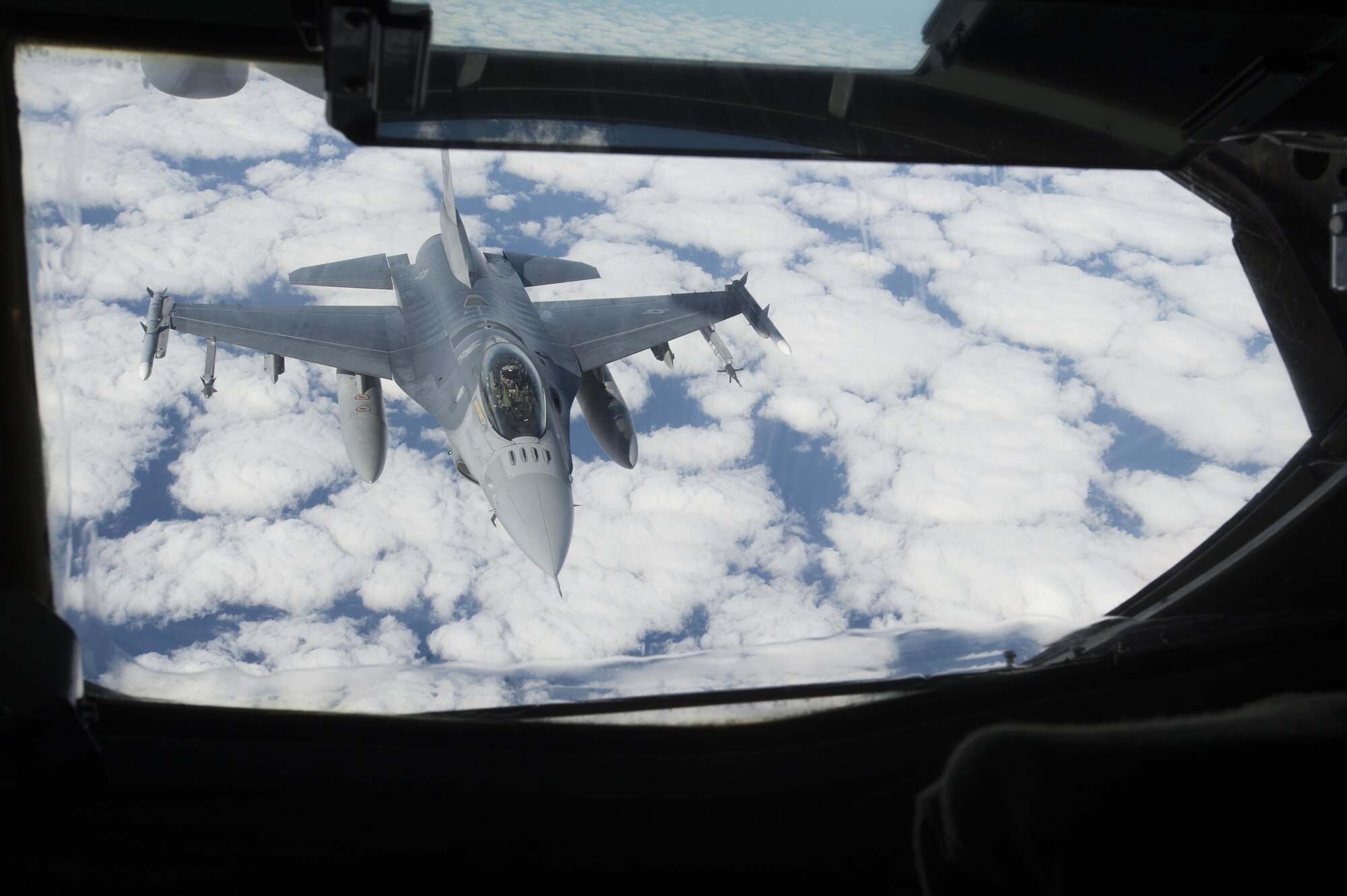 A U.S. Air Force F-16CM Fighting Falcon assigned to the 20th Fighter Wing approaches a KC-135 Stratotanker assigned to the 93rd Air Refueling Squadron from Fairchild Air Force Base, Wash., during collaborative refueling training over the Atlantic Ocean, Dec. 21, 2016. KC-135s are capable of carrying and transferring up to 200,000 pounds of fuel, extending the flying time of aircraft such as the F-16 by eliminating the need for pilots to refuel on land. (U.S. Air Force photo by Senior Airman Zade Vadnais)