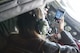 Sandra Vanta, a Team Shaw spouse, takes photos of her husband, Maj. Jason Vanta, 77th Fighter Squadron F-16CM Fighting Falcon pilot, as he refuels his jet from a KC-135 Stratotanker assigned to the 93rd Air Refueling Squadron from Fairchild Air Force Base, Wash., during a collaborative refueling training and spouse flight event over the Atlantic Ocean, Dec. 21, 2016. During the event, Team Shaw pilots were able to practice refueling procedures and their spouses were able to get a closer look at the job their husbands do every day. (U.S. Air Force photo by Senior Airman Zade Vadnais)