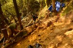 In this file photo, members of the Defense POW/MIA Accounting Agency (DPAA), work to remove a massive stone in an excavation unit as part of a DPAA recovery mission in To Mo Rong District, Kun Tum Province, Socialist Republic of Vietnam, Mar. 31, 2016. The mission of DPAA is to provide the fullest possible accounting for our missing personnel to their families and the nation.