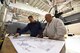 Master Sgt. Roland Selfridge (left), Aircraft Fuel Systems Shop Chief and Master Sgt. Art Fijalkowski, Fuels System Technician, both from the 914th Maintenance Squadron are reviewing a KC-135R fuel system schematic chart and comparing it to a C-130H2 in the fuels hangar at the Niagara Falls Air Reserve Station, N.Y. on January 6, 2017. The air reserve technicians are making preparations for the 914th Airlift Wing's upcoming conversion to the KC-135R Stratotanker. The aircraft in the background is the last scheduled Niagara C-130 to have fuel system maintenance performed on it. The first KC-135R is scheduled to arrive at the base in early February. (U.S. Air Force Photo by Peter Borys)