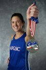 Second Lt. Kimberly Davis, 742nd Missile Squadron missile combat crew member, holds her 2016 Air Force Marathon medal at Minot Air Force Base, N.D., Dec. 15, 2016. Davis has competed in events like swimming in the 2012 U.S. Olympic team trials in Omaha, Nebraska, and running in the 2016 Air Force Marathon in Dayton, Ohio. (U.S. Air Force photo/Airman 1st Class Jonathan McElderry)