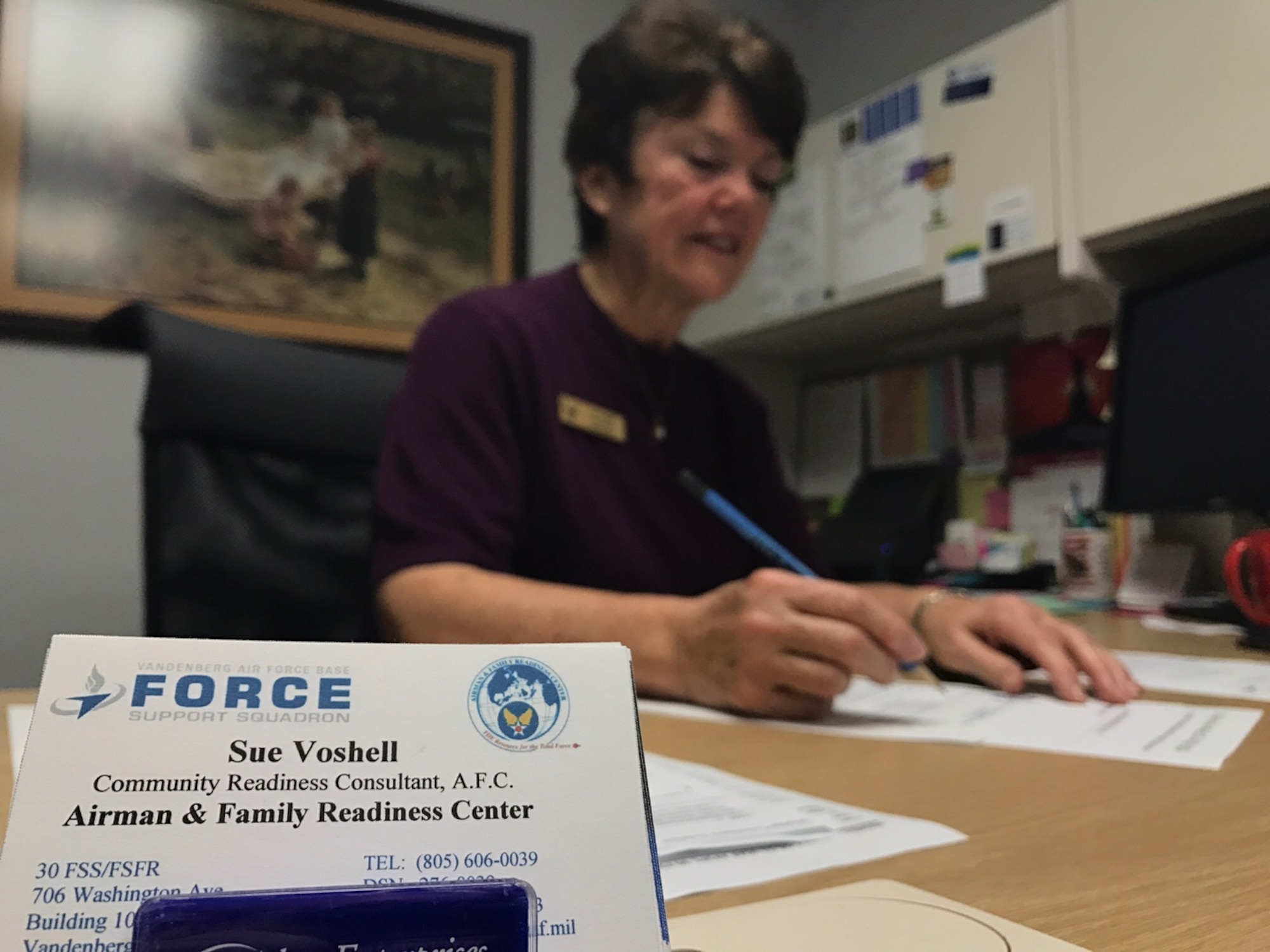 Sue Voshell, 30th Force Support Squadron personal financial readiness manager, works at her desk, ready to assist Airmen with their financial needs, Jan. 5, 2017, Vandenberg Air Force Base, Calif. With tax season approaching and annual raises hitting people’s bank accounts, it is important to have a plan in place for saving all that extra money or paying off debt. (U.S. Air Force photo by Senior Airman Ian Dudley/Released)