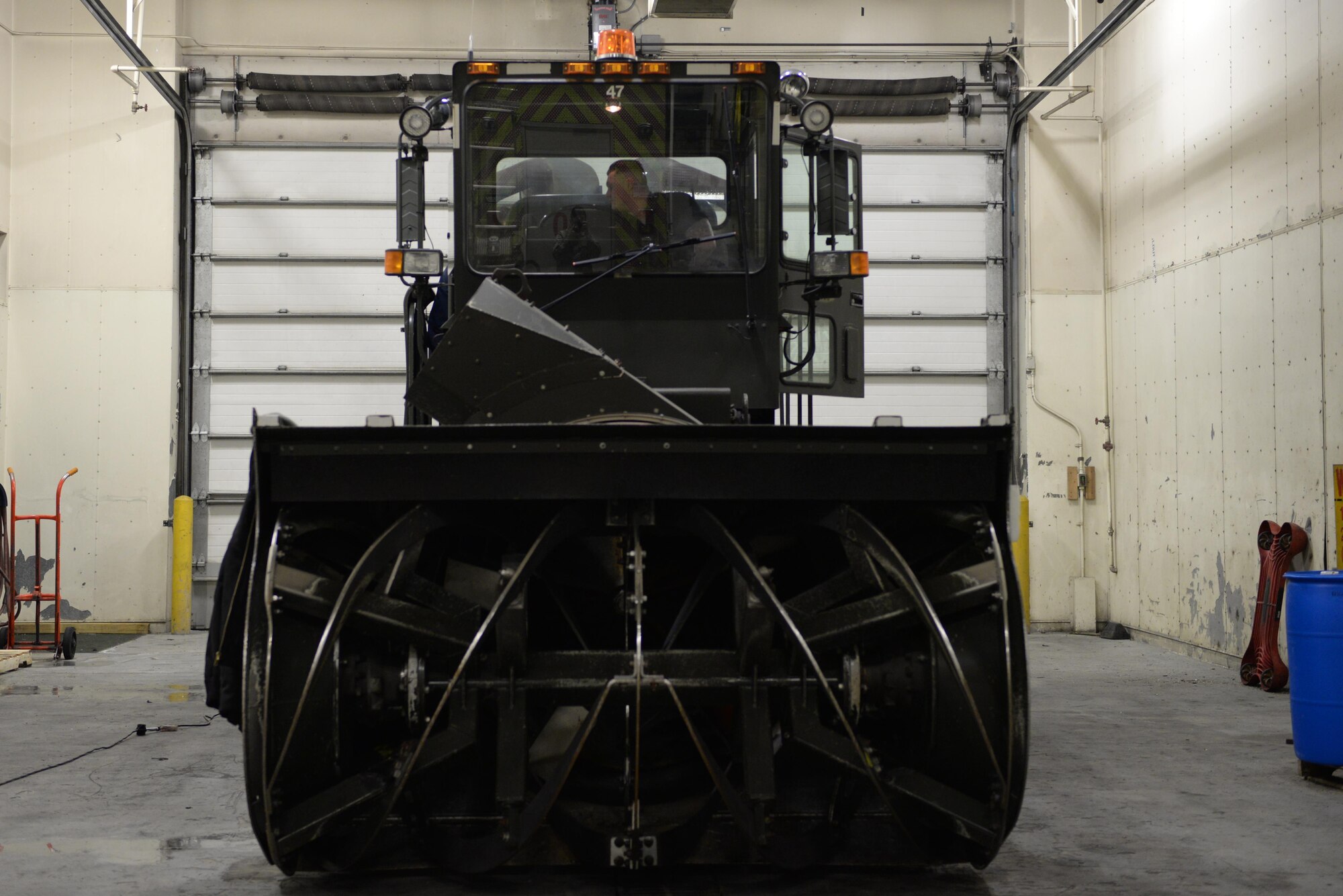 U.S. Air Force Senior Airman Dakota Greenwade, a 354th Logistics Readiness Squadron vehicle maintenance technician, turns on a grater Jan. 6, 2017, at Eielson Air Force Base, Alaska. The grater was in the process of being fixed due to a broken fuels shutdown solenoid, which keeps the engine running. (U.S. Air Force photo by Airman 1st Class Cassandra Whitman)