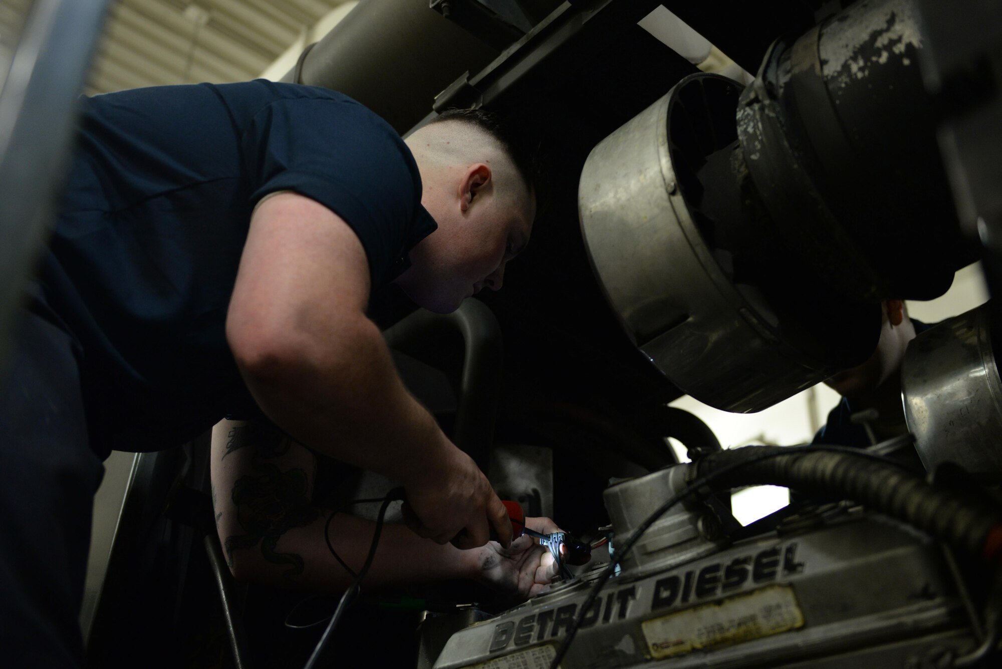 U.S. Air Force Senior Airman Dakota Greenwade, a 354th Logistics Readiness Squadron vehicle maintenance technician, uses a probing wire to diagnose a broken snow grater Jan. 6, 2017, at Eielson Air Force Base, Alaska. Greenwade tested the engine to find why it wouldn’t run correctly. (U.S. Air Force photo by Airman 1st Class Cassandra Whitman)