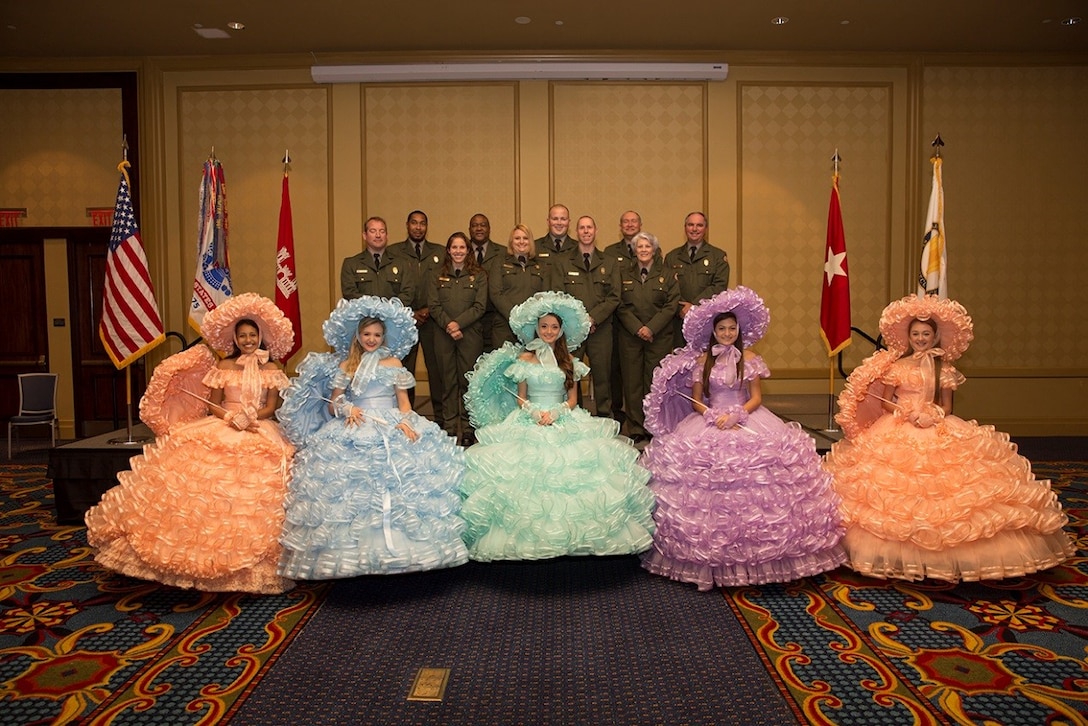 Park Rangers from the U.S. Army Corps of Engineers, Mobile District and Azalea Trail Maids greeted guests at the district Change of Command ceremony earlier this year in June. (Courtesy Photo; Kamryn Harvey pictured middle with green dress)