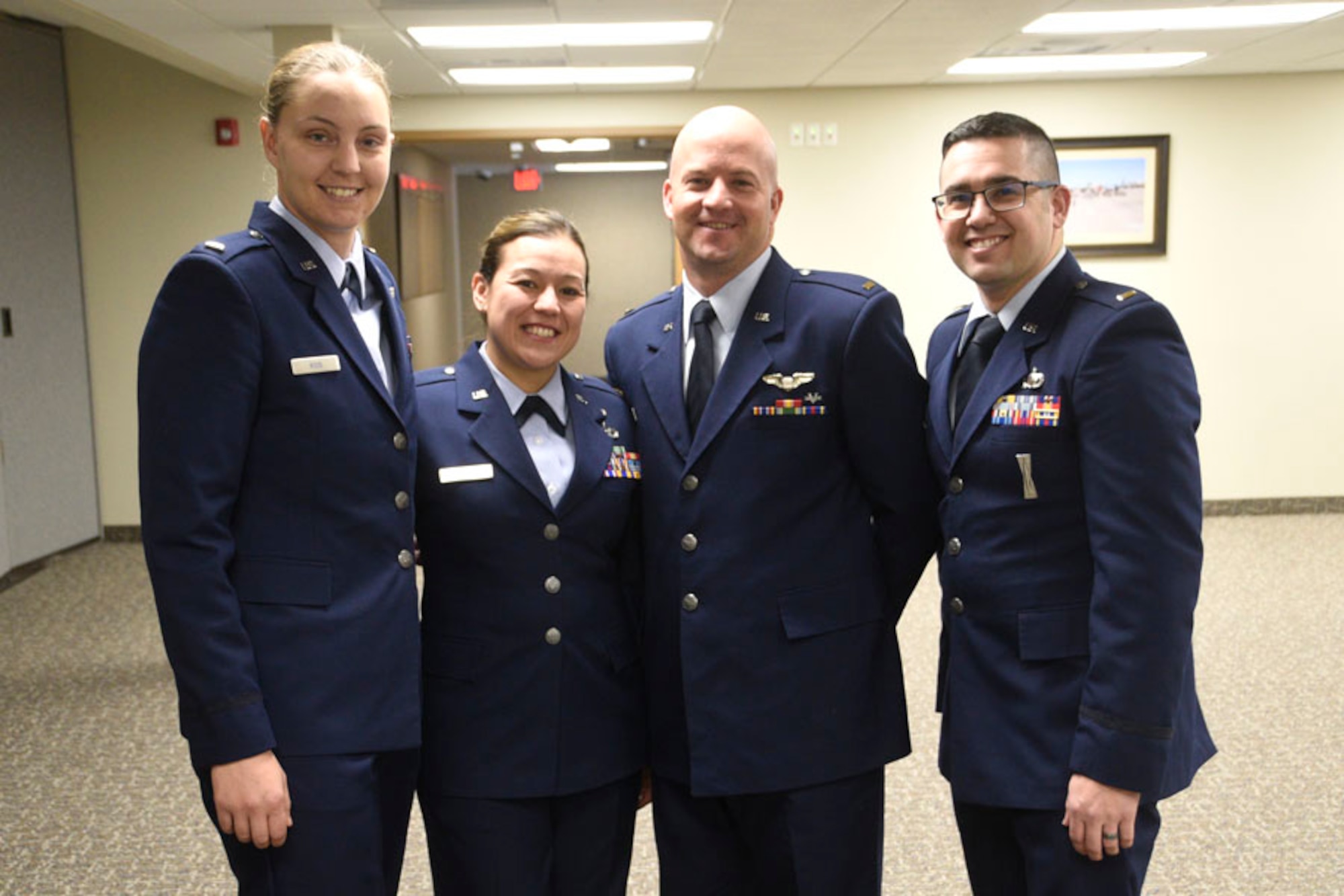Newly promoted 120th Airlift Wing officers 1st Lts. Cassandra L. Ross, Caressa L. Hewitt, Raymond R. Orsua and Bradley J. Gauvin pose for a group photo at the 120th Airlift Wing during their promotion ceremony on base Dec. 16, 2016. (U.S. Air National Guard photo/Senior Master Sgt. Eric Peterson)