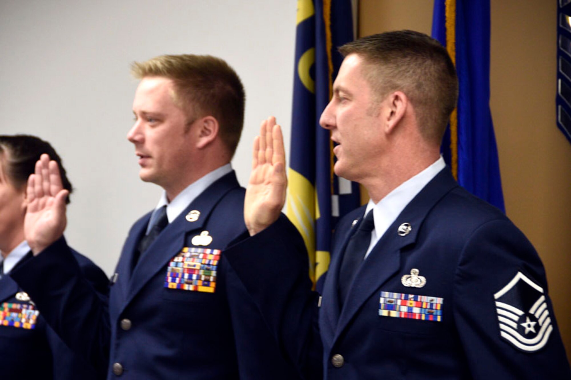 Master Sgts. Sean Keighley and Anthony Renenger take the oath during the Senior NCO Induction Ceremony held at the 120th Airlift Wing in Great Falls, Mont. Dec. 4, 2016. (U.S. Air National Guard photo/Senior Master Sgt. Eric Peterson)