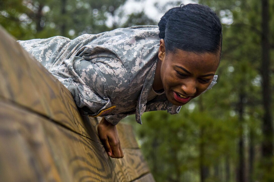 A soldier puts her mental and physical agility to the test as she and fellow soldiers tackle an obstacle course at Fort Bragg, N.C., Jan. 4, 2017, before going to air assault school. The soldiers are paratroopers assigned to the 82nd Airborne Division Sustainment Brigade. The school teaches soldiers how to use rotary wing assets to accomplish a mission. Army photo by Sgt. Daniel Schroeder