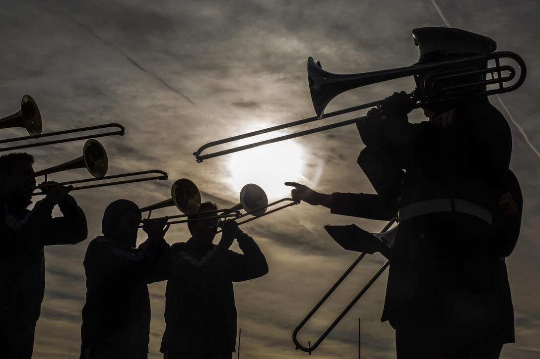 Marines practice musical techniques with student trombone players at Terry Parker High School in Jacksonville, Fla., Dec. 30, 2016. The musicians performed in the TaxSlayer Bowl's halftime show the following day. Marine Corps photo by Lance Cpl. Jack A. E. Rigsby