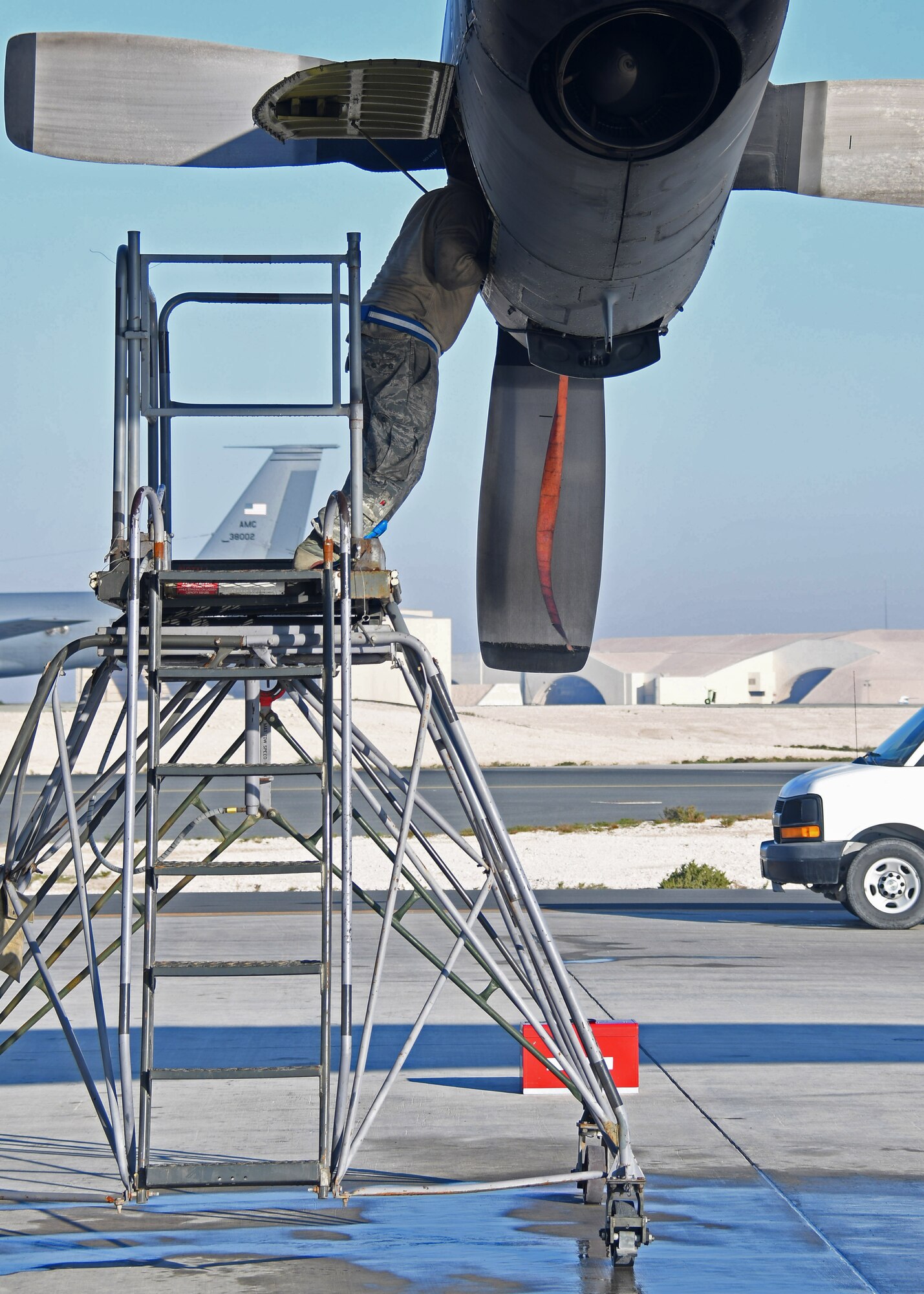 U.S. Staff Sgt. Dale Claugh, an engine mechanic with the 379th Expeditionary Aircraft Maintenance Squadron, 746th Expeditionary Aircraft Maintenance Unit, checks an engine on a C-130 Hercules for dust at Al Udeid Air Base, Qatar, Dec. 30, 2016. Claugh was conducting a 30-day desert inspection on the engines, where the engine is inspected for and cleaned of debris and sand from flying in a desert environment. (U.S. Air Force photo by Senior Airman Miles Wilson)