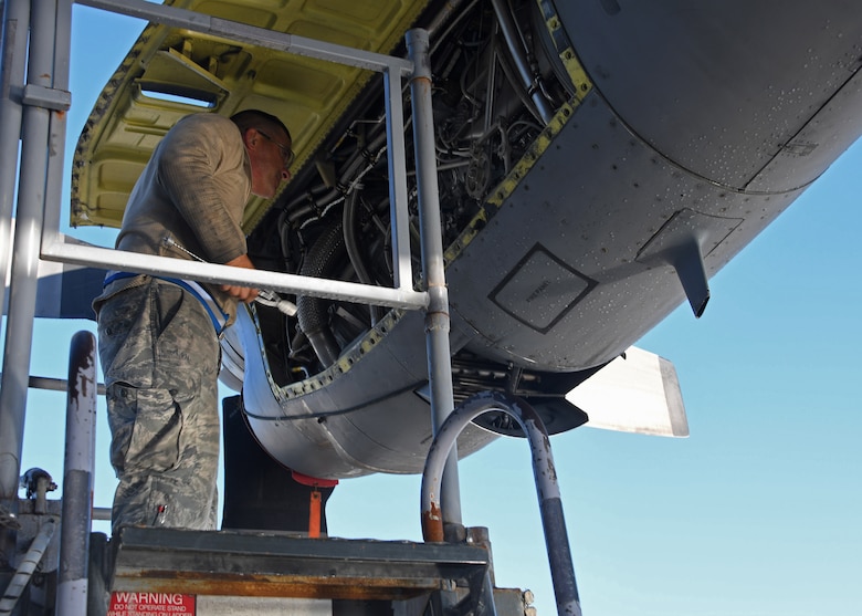 U.S. Staff Sgt. Dale Claugh, an engine mechanic with the 379th Expeditionary Aircraft Maintenance Squadron, 746th Expeditionary Aircraft Maintenance Unit, checks an engine on a C-130 Hercules for dust at Al Udeid Air Base, Qatar, Dec. 30, 2016. Claugh was conducting a 30-day desert inspection on the engines, during which the engine is inspected for and cleaned of debris and sand from flying in a desert environment. (U.S. Air Force photo by Senior Airman Miles Wilson)