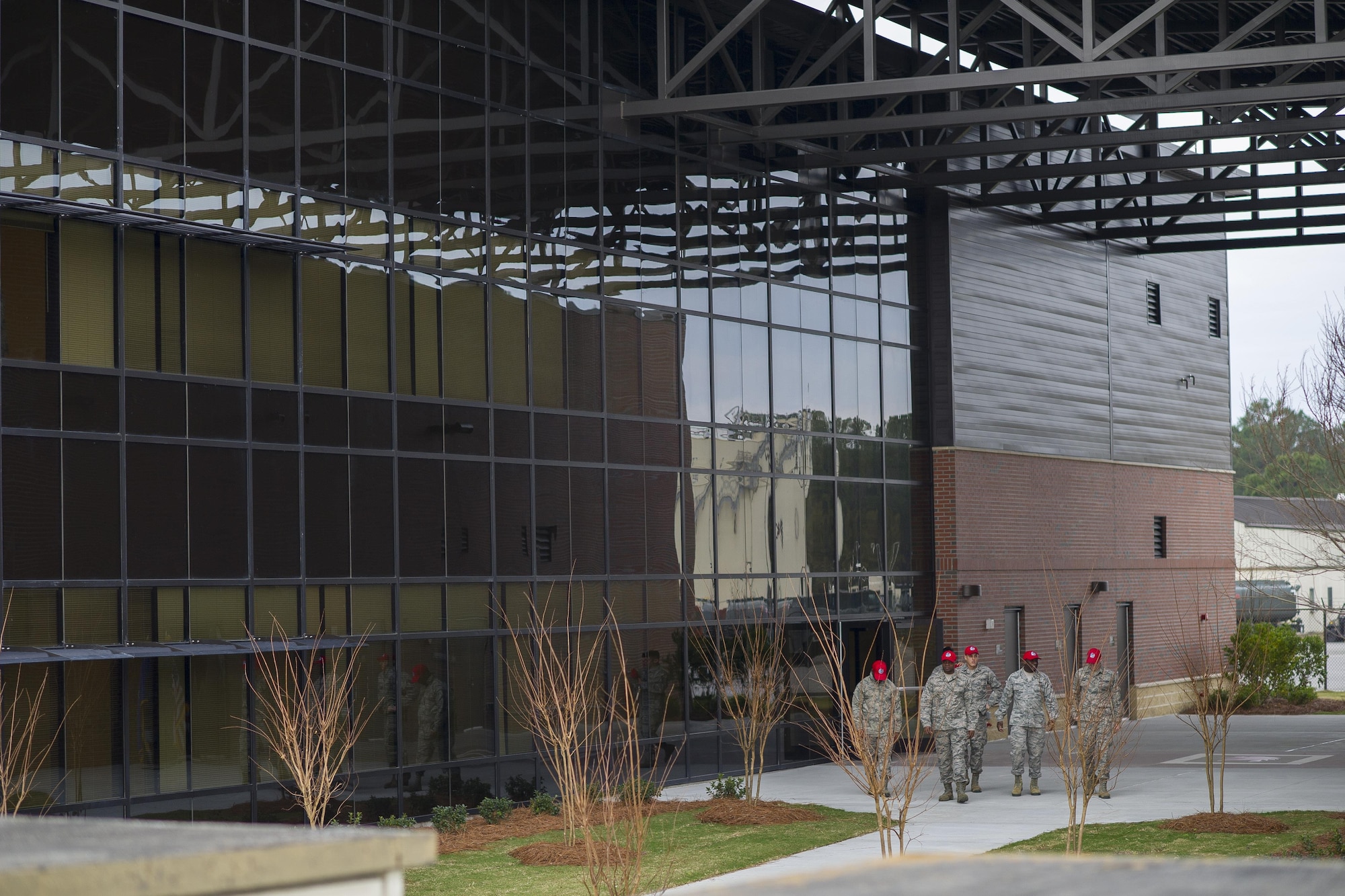 Members from the 560th RED HORSE Squadron, along with joint mission partners and special guests, attend a ribbon cutting ceremony for the opening of a new readiness and training facility Jan. 6, 2017, at Joint Base Charleston, South Carolina. The new buildings will provide dedicated areas for the unit's offices, shops and storage (U.S. Air Force photo by Senior Airman Jonathan Lane).