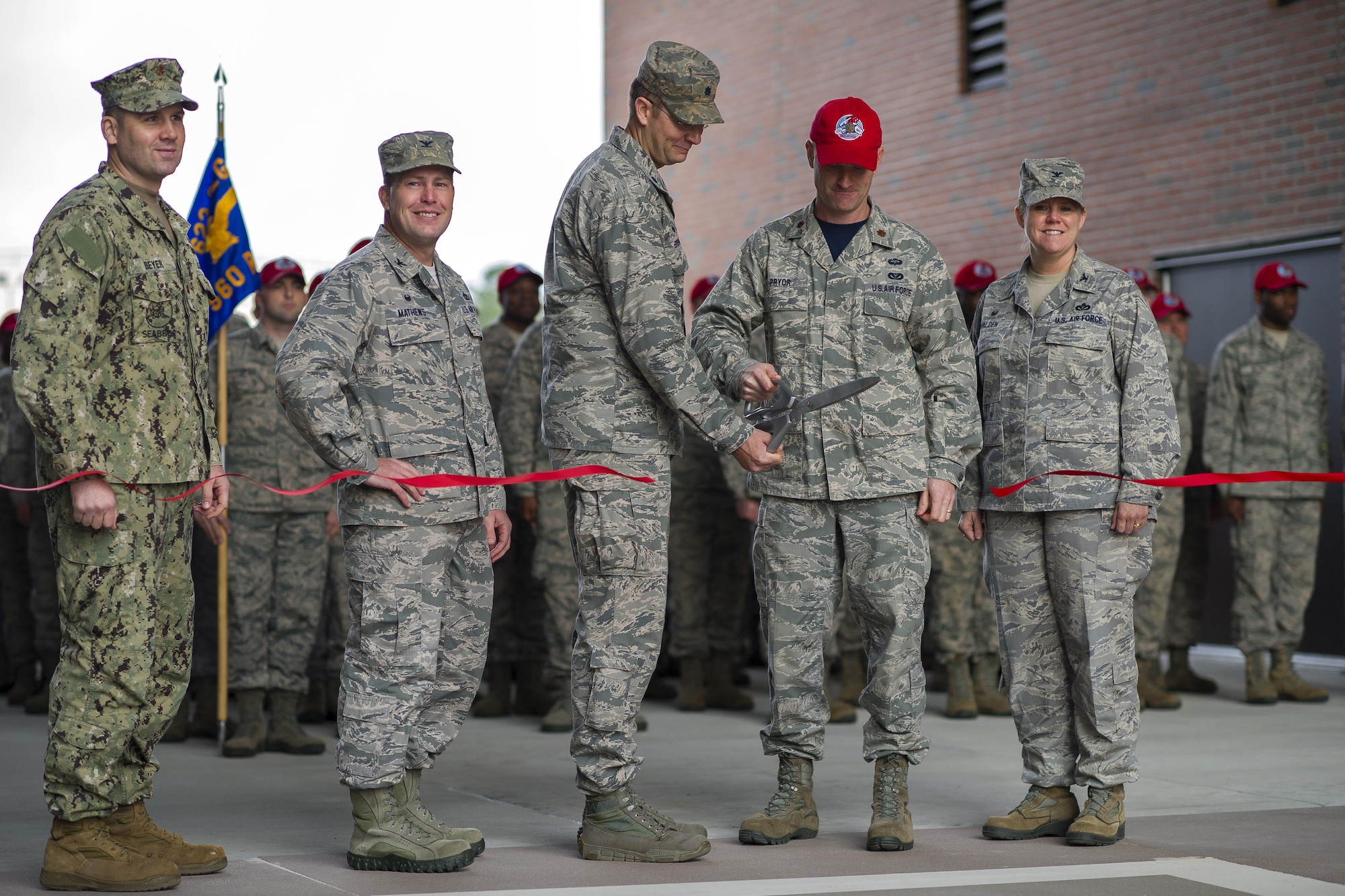Members from the 560th RED HORSE Squadron, along with joint mission partners and special guests, attend a ribbon cutting ceremony for the opening of a new readiness and training facility Jan. 6, 2017, at Joint Base Charleston, South Carolina. The new buildings will provide dedicated areas for the unit's offices, shops and storage (U.S. Air Force photo by Senior Airman Jonathan Lane).