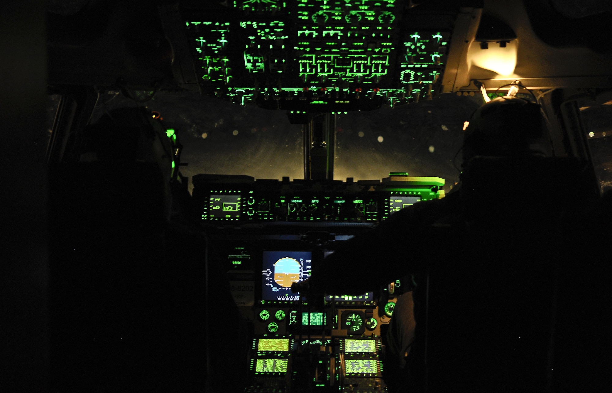 Captain Andrew Rast (left) and Lt. Col. J.W. Smith (right), 304th Expeditionary Airlift Squadron C-17 pilots, bring a C-17 to a halt on Pegasus Ice Runway near McMurdo Station, Antarctica July 15, 2016, as part of Operation Deep Freeze. ODF is the military support component of the National Science Foundation-managed U.S. Antarctic Program. U.S. military personal are now trained and ready to support this vital mission year-round despite the austere environment, allowing for additional research to be conducted in Antarctica. (U.S. Air Force Reserve photo by Staff Sgt. Madelyn McCullough)