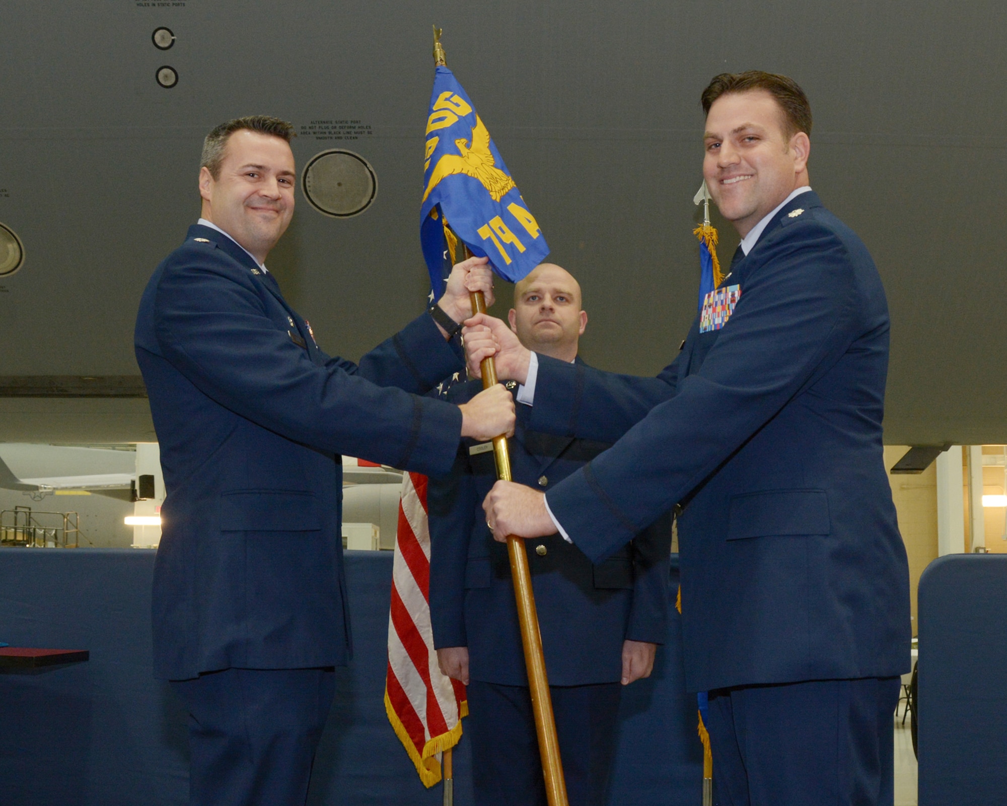 U.S. Air Force Lt. Col. Joseph D. Wall receives a guidon from Lt. Col. Daniel Stout, acting 349th Operations Group Commander during a change of command ceremony for the 79th Air Refueling Squadron at Travis Air Force Base, Calif., Jan. 7, 2017.  Wall takes command of the Air Force Reserve KC-10 Extender squadron as one of only a handful of active-duty officers in command of reserve units.  He previously served as the director of operations for the 821st Contingency Response Group, also at Travis.  (U.S. Air Force photo by Senior Airman Chris Massey)