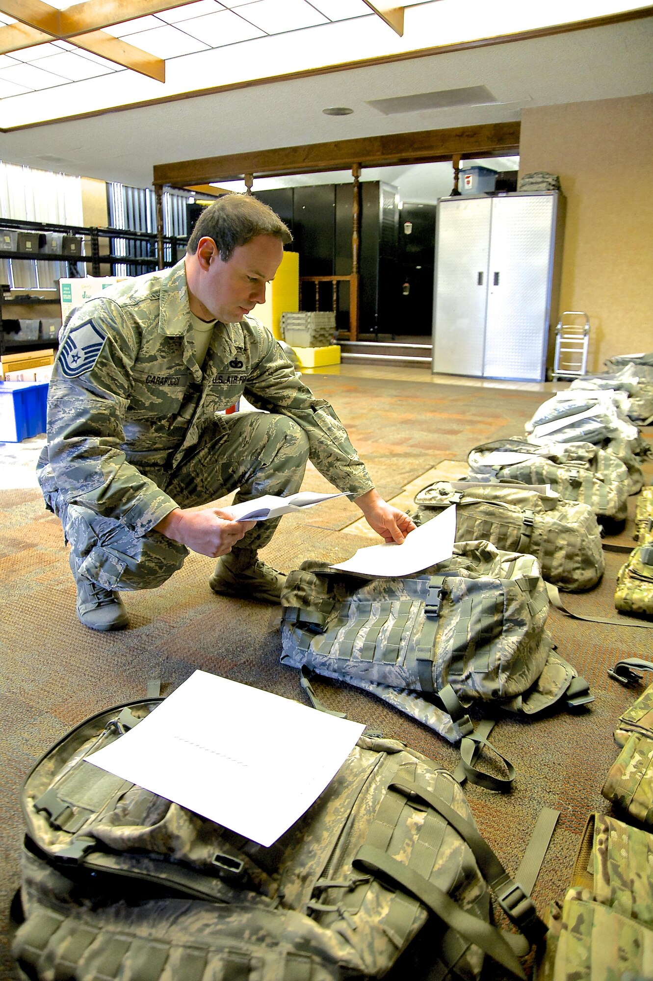 Master Sgt. Paul Carapucci, 926th Security Forces Squadron noncommissioned officer in charge of supply, checks equipment against a list for a training pack used by 926th SFS Airmen. Carapucci was recently named Air Force Reserve Command’s Outstanding Security Forces Air Reserve Component Noncommissioned Officer of 2016. (U.S. Air Force photo by Senior Airman Alexandria Slade)