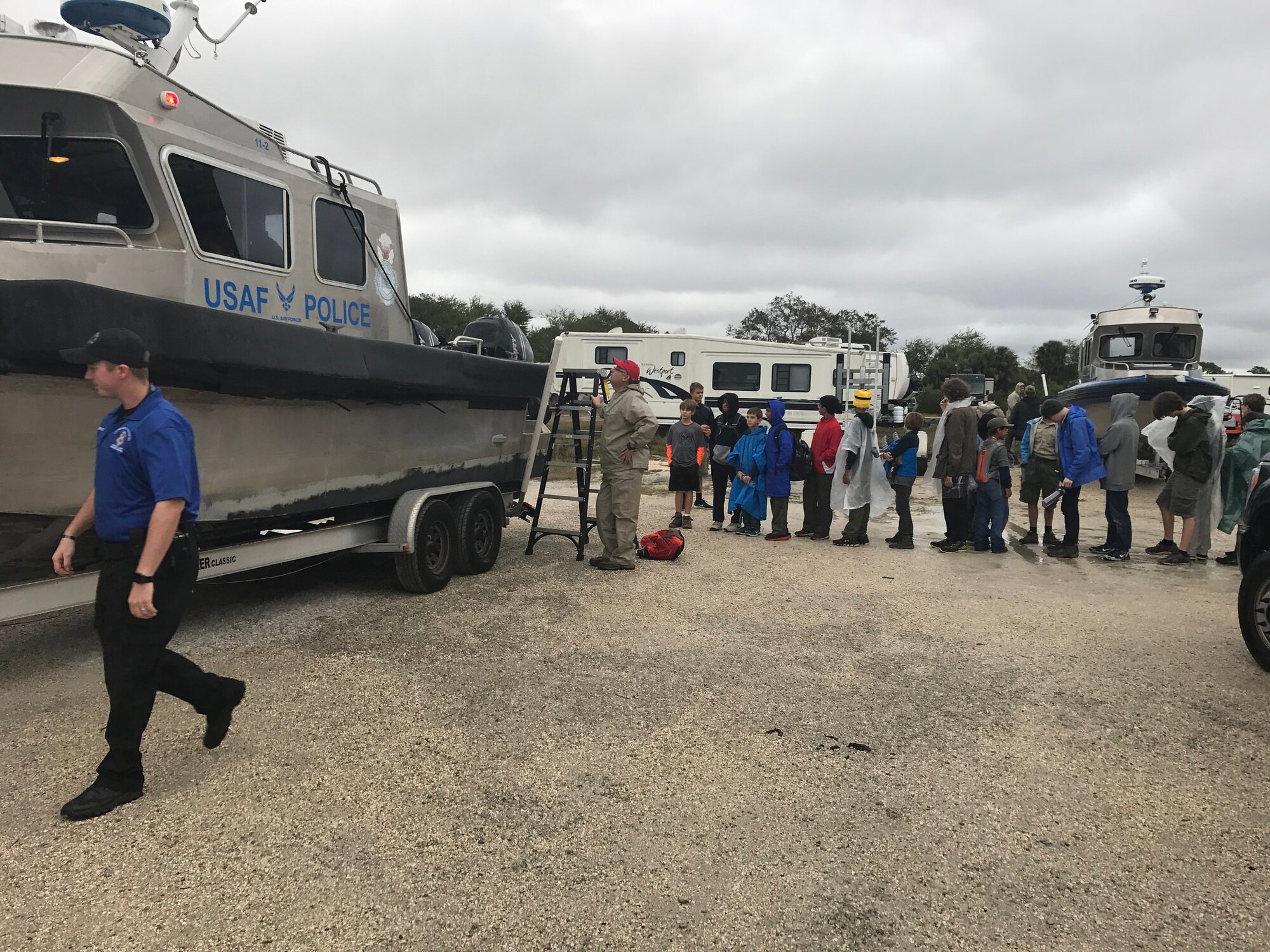Boy Scout Troops from the local Tampa Bay area line up before touring a marine patrol boat at MacDill Air Force Base, FL Jan. 7, 2017. The Boy Scouts of America is one of the nation's largest and most prominent values-based youth development organizations. (U.S. Air Force photo by Staff Sgt. Xavier Lockley)