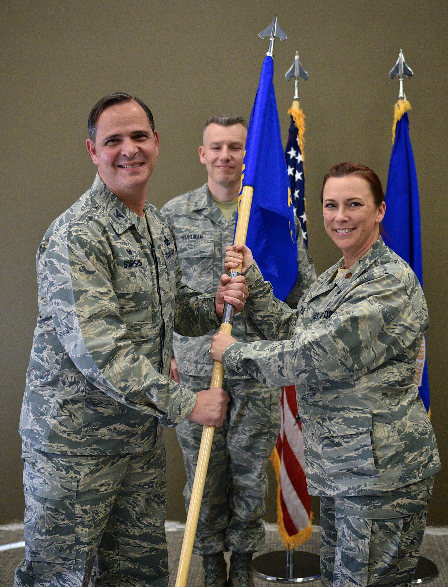 Maj. Roxzanna Ponce De Leon takes command of the 932nd Force Support Squadron from Col. Christopher Simpson, 932nd Mission Support Group commander during the change of command ceremony Jan. 7, 2017, Scott Air Force Base, Illinois. Ponce De Leon, known by her coworkers as PDL, was the 932nd Force Support Operations officer.  (U.S. Air Force photo by Tech. Sgt. Christopher Parr)