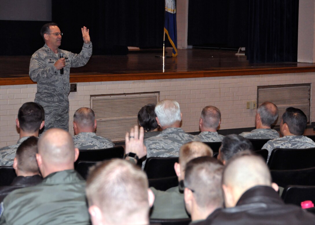 Col. Mark S. Larson, 931st Air Refueling Wing commander, asks for a show of hands during a commander's call Jan. 8, 2017, McConnell Air Force Base, Kansas. Larson spoke to Citizen Airmen, relating advice from William Shakespeare's Henry V to upcoming deployments. (U.S. Air Force photo by Senior Airman Preston Webb)