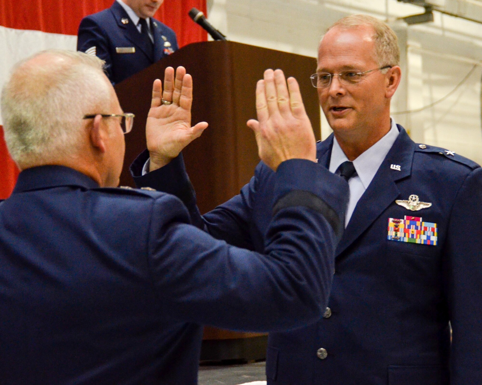 Maj. Gen. John Stokes, 22nd Air Force commander, administers the oath of office promoting Brig. Gen. Steven Parker, 94th Airlift Wing commander, to his new rank, Jan. 6, 2017. (U.S. Air Force photo / Tech. Sgt. Kelly Goonan) 

