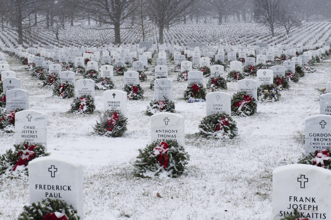 The first significant snowfall of the season blankets headstones and wreaths in Section 60 of Arlington National Cemetery, Va., Jan. 7, 2017. Army photo by Rachel Larue