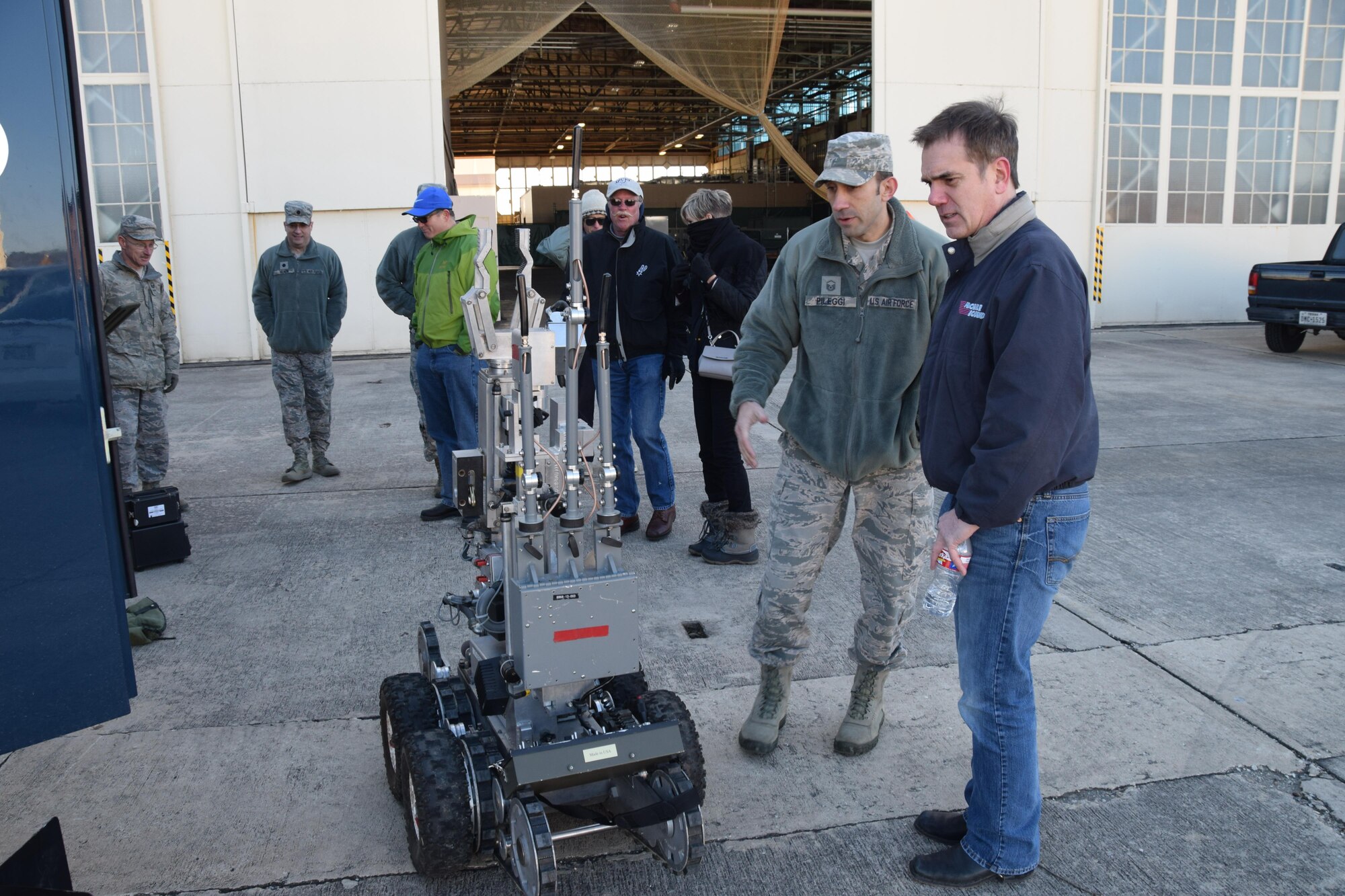 Master Sgt. Adam Pileggi, an explosive ordnance technician with the 433rd Civil Engineering Squadron, explains the features of the F 6 bomb disposal robot to Honorary Commander George Baillet (right) from the San Antonio Housing Commission Jan. 7, 2017 at Joint Base San Antonio-Lackland, Texas. The capabilities and technology used by the explosive ordnance disposal Airmen was part of the tour of the 433rd Mission Support Group. (U.S. Air Force photo/Tech. Sgt. Carlos J. Trevino) 