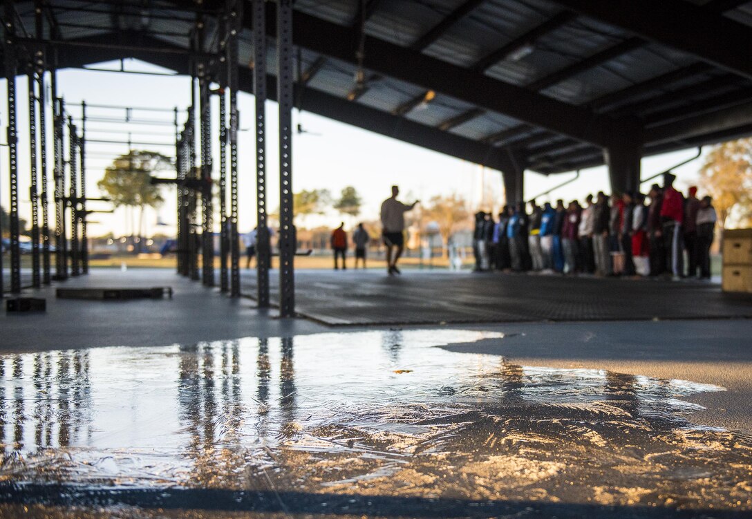 Frozen water covers a portion of the warrior fitness pad as Chief Master Sgt. Brian Bischoff, 919th Special Operations Wing command chief, motivates the development and training flight amid the 23 degree morning temperatures Jan. 8 at Duke Field, Fla.  The Airmen within the flight attend the monthly training assembly and learn about the Air Force and Reserve prior to going to basic military training.  (U.S. Air Force photo/Tech. Sgt. Sam King)