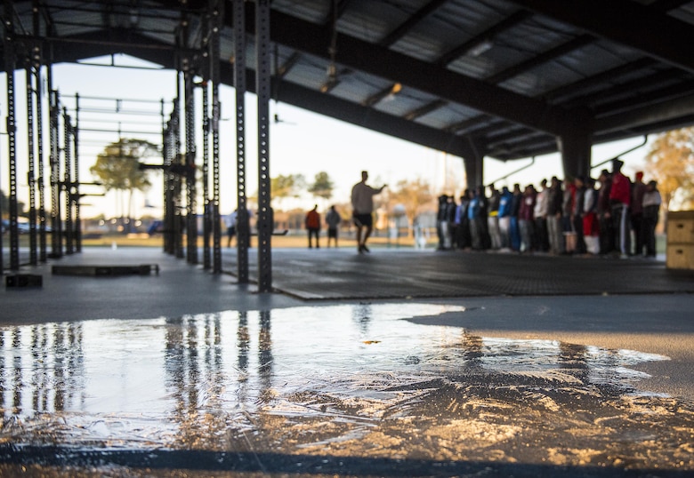 Frozen water covers a portion of the warrior fitness pad as Chief Master Sgt. Brian Bischoff, 919th Special Operations Wing command chief, motivates the development and training flight amid the 23 degree morning temperatures Jan. 8 at Duke Field, Fla.  The Airmen within the flight attend the monthly training assembly and learn about the Air Force and Reserve prior to going to basic military training.  (U.S. Air Force photo/Tech. Sgt. Sam King)