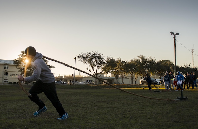 An Airman with the development and training flight pulls a weight sled during a chilly 23 degree morning physical training session Jan. 8 at Duke Field.  The Airmen within the flight attend the monthly training assembly and learn about the Air Force and Reserve prior to going to basic military training.  (U.S. Air Force photo/Tech. Sgt. Sam King)