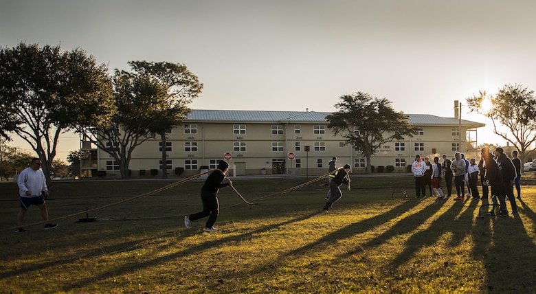 Airmen with the development and training flight pull weight sleds during a chilly 23 degree morning physical training session Jan. 8 at Duke Field.  The Airmen within the flight attend the monthly training assembly and learn about the Air Force and Reserve prior to going to basic military training.  (U.S. Air Force photo/Tech. Sgt. Sam King)