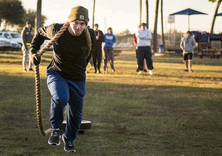 Airman 1st Class Mickel Cssszar, development and training flight, pulls a weight sled during a chilly 23 degree morning physical training session Jan. 8 at Duke Field.  The Airmen within the flight attend the monthly training assembly and learn about the Air Force and Reserve prior to going to basic military training.  (U.S. Air Force photo/Tech. Sgt. Sam King)