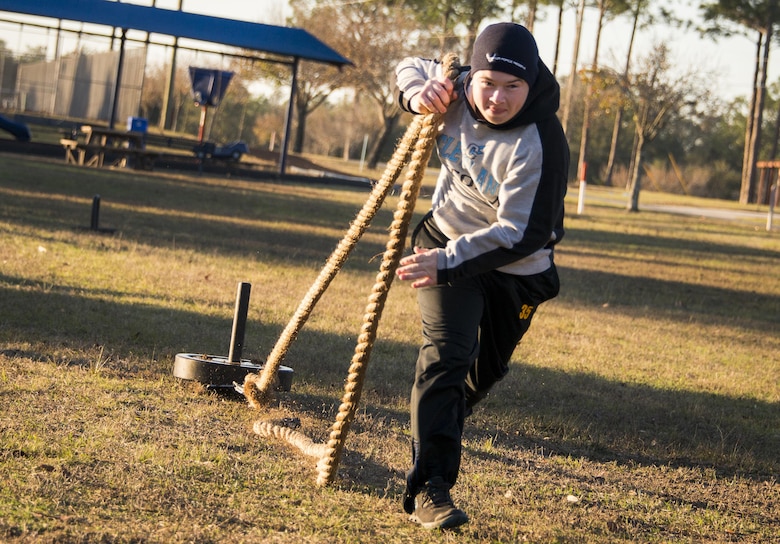 Michael Sanders, development and training flight, pulls a weight sled during a chilly 23 degree morning physical training session Jan. 8 at Duke Field.  The Airmen within the flight attend the monthly training assembly and learn about the Air Force and Reserve prior to going to basic military training.  (U.S. Air Force photo/Tech. Sgt. Sam King)