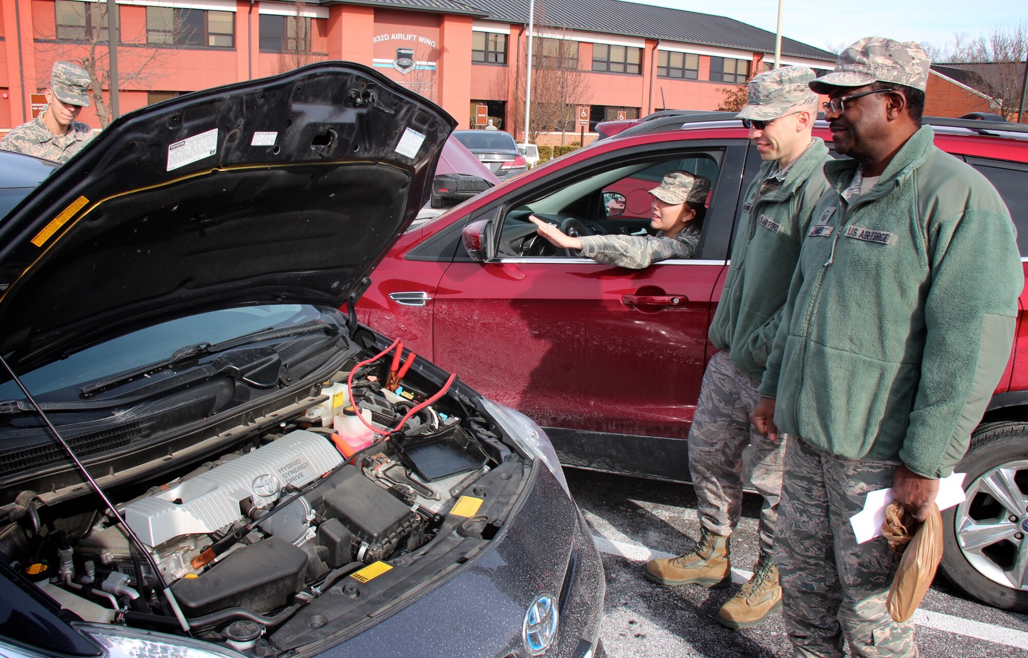 Does being an Air Force reservist charge your battery?  932nd Airlift Wing members not only energize the mission by training each other during the busy Unit Training Assembly (UTA), they also occasionally help jump start each other's cars during extremely cold winter weather.  Here, Staff Sgt. Ericha Erlinger, 932nd Aeromedical Staging Squadron, gives encouragement to a fellow Airman, as other unit members watch the process, January 8, 2017, Scott Air Force Base, Ill.  (U.S. Air Force photo by Lt. Col. Stan Paregien)