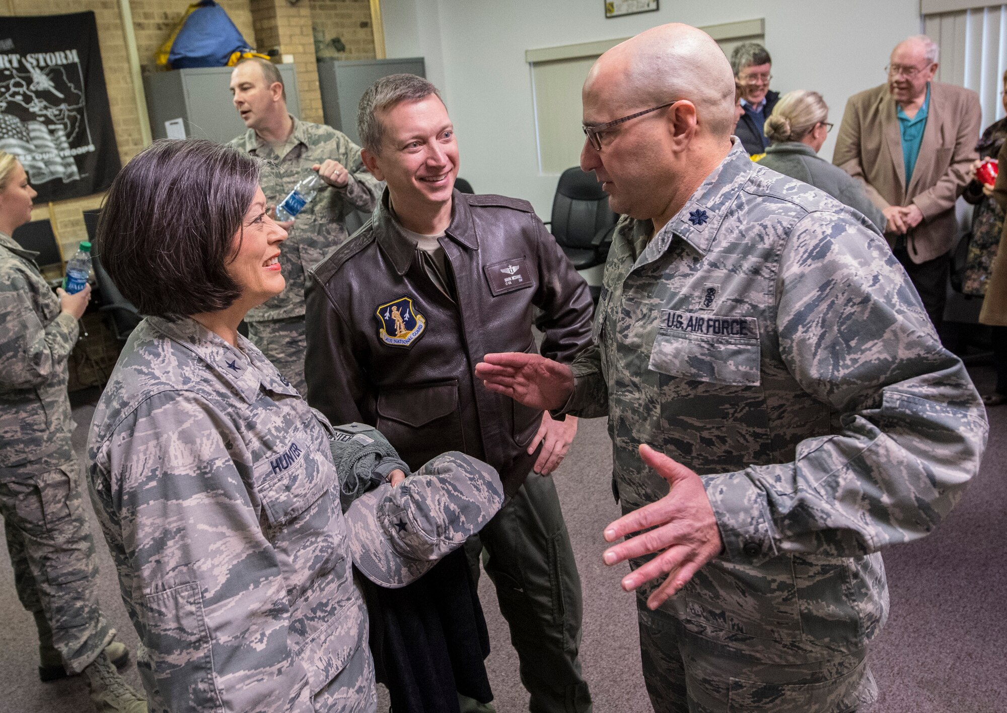 Lt. Col. J.D. Underwood talks with Brig. Gen. Paige Hunter, commander of the West Virginia Air National Guard, and Lt. Col. Mark McDaniel, 130th Medical Group flight surgeon after assuming command of the 130th MDG, Jan. 8, 2017 at McLaughlin Air National Guard Base, Charleston, W.Va. Underwood previously served as the senior administrator for the 130th MDG prior to taking command. (U.S. Air National Guard photo by Tech. Sgt. De-Juan Haley) 