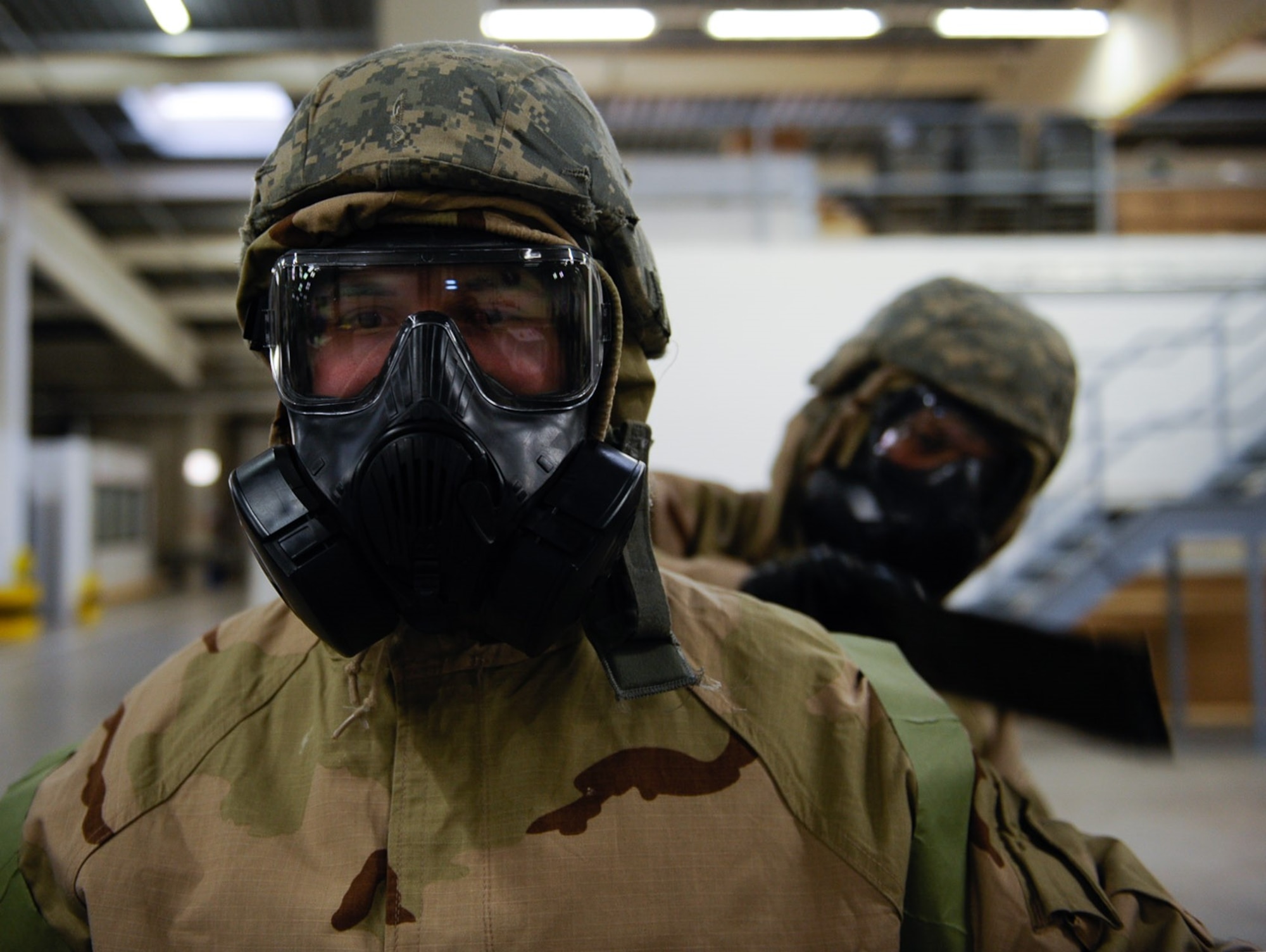 Senior Airman Kenneth Sargent, 1st Communications Maintenance Squadron cable and antenna theater maintenance technician, receives a chemical, biological, radiological, or nuclear defense check during a CBRN course at Ramstein Air Base, Germany, Jan. 4, 2017. During the course, Airmen conducted CBRN defense checks to ensure the absence of contamination. (U.S. Air Force photo by Airman 1st Class Savannah L. Waters)