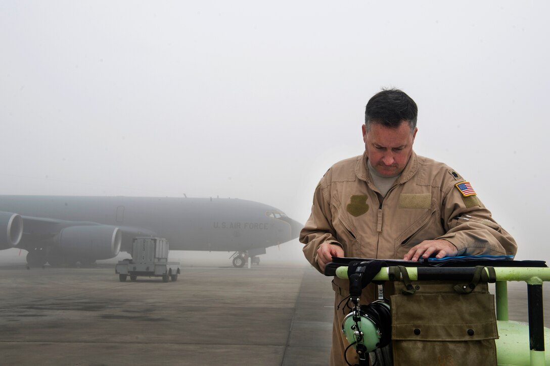 Air Force Lt. Col. Tate Whitener reviews his mission notes before a refueling mission in support of an Operation Freedom’s Sentinel mission at Al Udeid Air Base, Qatar, Jan. 3, 2017. Whitener is a pilot assigned to the 340th Expeditionary Air Refueling Squadron. Air Force photo by Staff Sgt. Matthew B. Fredericks