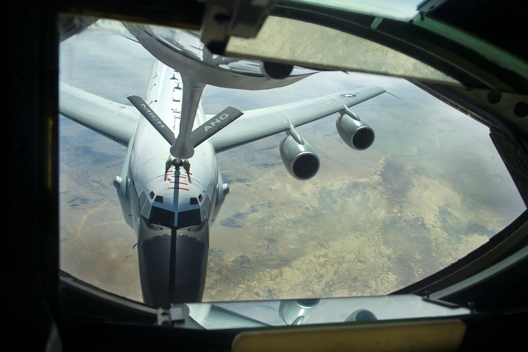 Air Force Senior Airman Jordan Kaminski, not shown, controls a refueling boom from the boom operator's station as he refuels an RC-135 Rivet Joint reconnaissance aircraft during an Operation Freedom’s Sentinel mission over Afghanistan, Jan. 3, 2017. Kaminski is a boom operator assigned to the 340th Expeditionary Air Refueling Squadron. Air Force photo by Staff Sgt. Matthew B. Fredericks