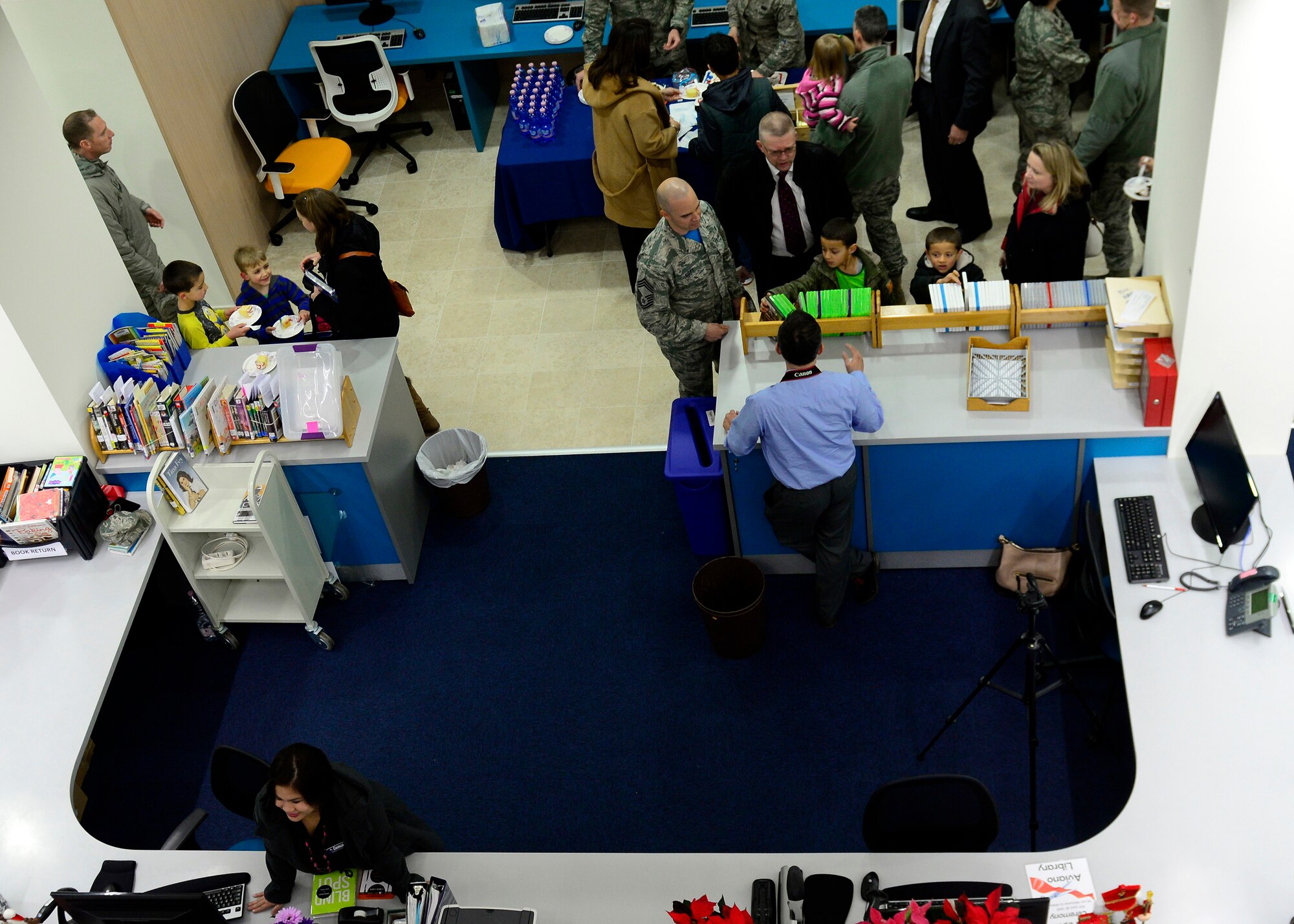 Team Aviano members tour the new library during the grand opening event at Aviano Air Base, Italy on Jan. 6, 2017. The library consists of more than 34,000 books, DVDs and video games. (U.S. Air Force photo by Senior Airman Cary Smith)