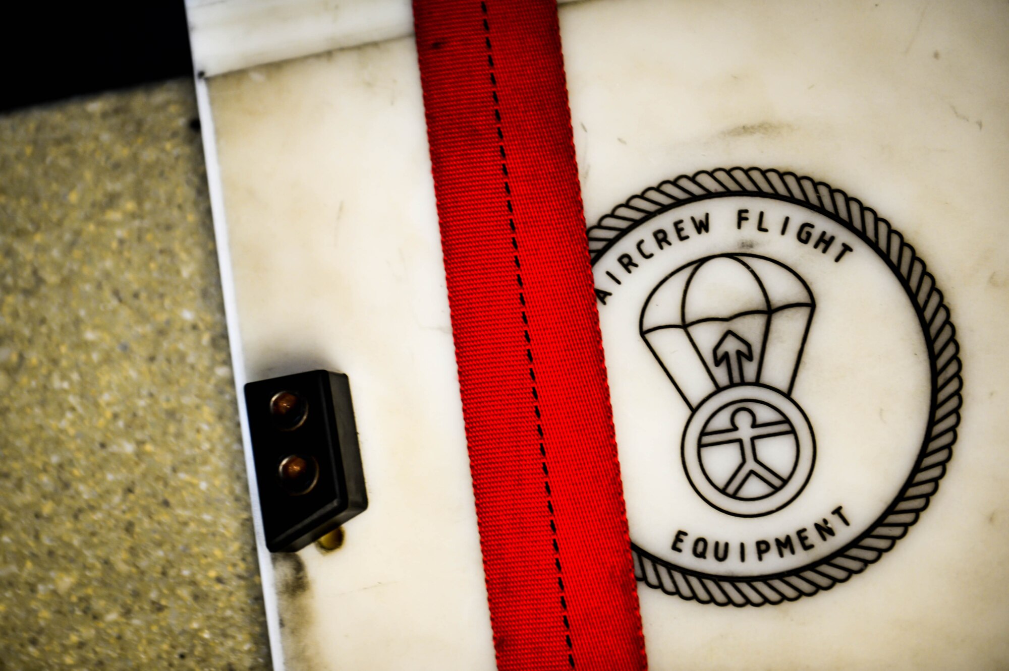 A parachute harness lays across a parachute station at the 20th Operation Support Squadron aircrew flight equipment work center at Shaw Air Force Base, S.C., Jan. 4, 2017. Along with parachutes, AFE Airmen pack survival kits for F-16 pilots. (U.S. Air Force photo by Airman 1st Class Christopher Maldonado)