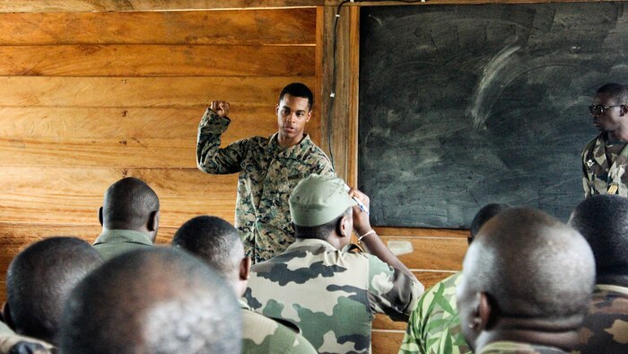 Lance Cpl. Yensli Herediadisla, a rifleman with Special Purpose Marine Air-Ground Task Force Crisis Response-Africa, teaches a class to the Gabonese Armed Forces at Camp Mokekou, Gabon, Nov. 10, 2016. Marines trained together with the Gabonese Agency for National Parks and Gabonese Armed Forces to help combat illicit trafficking in the region. 