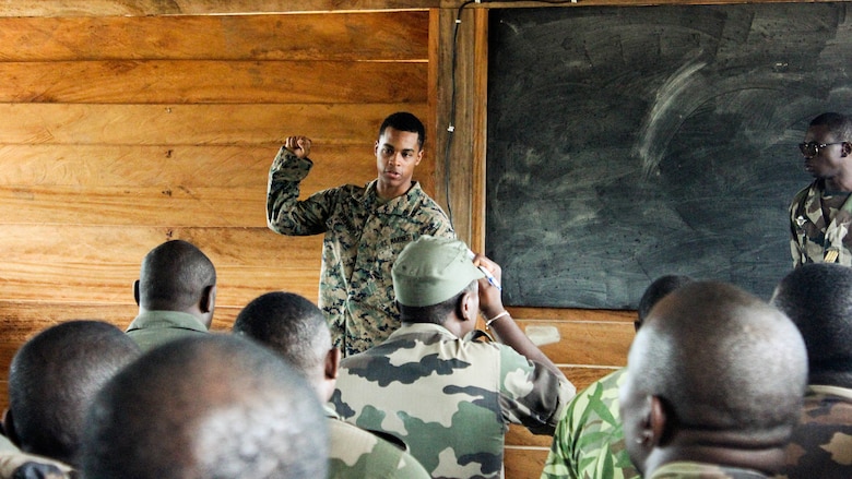 Lance Cpl. Yensli Herediadisla, a rifleman with Special Purpose Marine Air-Ground Task Force Crisis Response-Africa, teaches a class to the Gabonese Armed Forces at Camp Mokekou, Gabon, Nov. 10, 2016. Marines trained together with the Gabonese Agency for National Parks and Gabonese Armed Forces to help combat illicit trafficking in the region. 