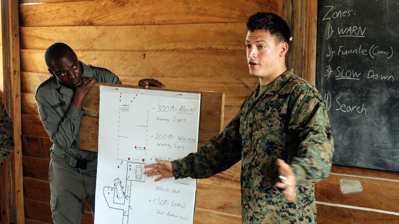Lance Cpl. Nathaniel Madison, a rifleman with Special Purpose Marine Air-Ground Task Force Crisis Response-Africa, teaches an entry control point class to the Gabonese Armed Forces at Camp Mokekou, Gabon, Nov. 15, 2016. Marines trained together with the Gabonese Agency for National Parks and Gabonese Armed Forces to help combat illicit trafficking in the region.)