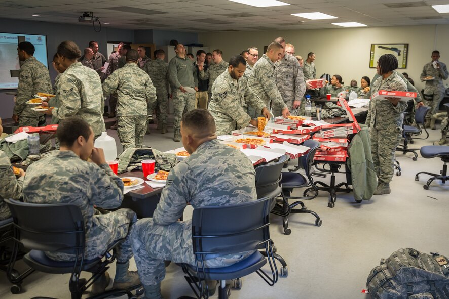 Airmen from the 315th Airlift Wing Security Forces Squadron enjoyed a pizza luncheon Jan. 6, 2017 at Joint Base Charleston.  
A Charleston area church provided the pizza, which is a show of support for deploying Airmen and led by the 315th AW Chaplaincy Service.  (U.S. Air Force photo by Master Sgt. Shane Ellis)
