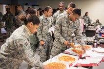 Airmen from the 315th Airlift Wing Security Forces Squadron enjoyed a pizza luncheon Jan. 6, 2017 at Joint Base Charleston.  
A Charleston area church provided the pizza, which is a show of support for deploying Airmen and led by the 315th AW Chaplaincy Service.  (U.S. Air Force photo by Master Sgt. Shane Ellis)
