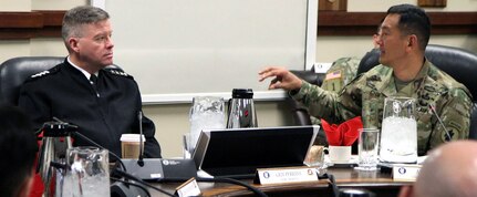 Maj. Gen. K.K. Chinn, U.S. Army South commanding general, explains to Gen. David G. Perkins, commanding general of U.S. Army Training and Doctrine Command, or TRADOC, how his ARSOUTH uses TRADOC resources to support its mission in the command's area of operations. Chinn also briefed future opportunities and ways that TRADOC can assist in enhancing mission accomplishment. 