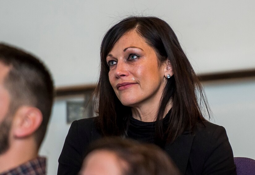 Nicole Withrow, from Wooster, Ohio, niece of Chief Warrant Officer 5 Mary Alice Hustetler, listens intently during Hostetler's retirement ceremony at the Womens Millitary Memorial on Jan. 7 in Arlington, Virginia. Hostetler enlisted into the Army in July 1976 and was promoted to CW5 in April 2013 as the Command Chief Warrant Officer of the 200th Military Police Command. Hostetler served more than 40 years in the United States Army. Hostetler accomplished many milestones, from being the first female in a military police company, the first female to provide protective services in a combat zone, to leading a team in charge of protecting the Secretary of Defense. Hostetler says of all the things she's done in her career, the best thing she's ever done was wear the Army uniform. (Army Reserve Photo By: Sgt. 1st Class Sun Vega)