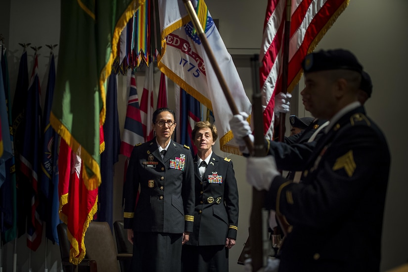 Brig. Gen. Marion Garcia, commander, 200th Military Police Command and Chief Warrant Officer 5 Mary Alice Hostetler stand for the posting of the colors during Hostetler's retirement ceremony at the Women's Millitary Memorial on Jan. 7 in Arlington, Virginia. Hostetler enlisted into the Army in July 1976 and was promoted to CW5 in April 2013 as the Command Chief Warrant Officer of the 200th Military Police Command. Hostetler served more than 40 years in the United States Army. Hostetler accomplished many milestones, from being the first female in a military police company, the first female to provide protective services in a combat zone, to leading a team in charge of protecting the Secretary of Defense. Hostetler says of all the things she's done in her career, the best thing she's ever done was wear the Army uniform. (Army Reserve Photo By: Sgt. 1st Class Sun Vega)