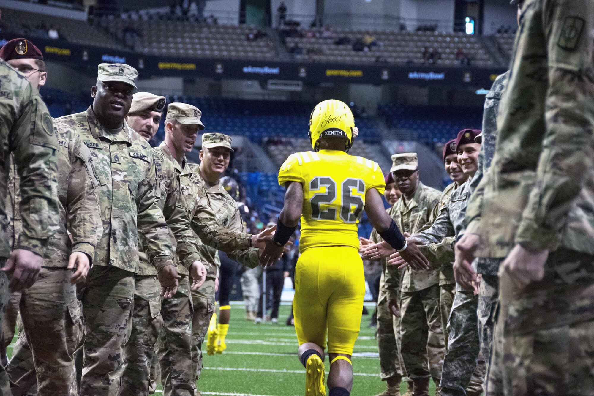 U.S. Army Soldier Mentors march onto the field during the opening of the 2017 Army All-American Bowl. The Nation’s top athletes and marching band members participated in the event in San Antonio, TX. 