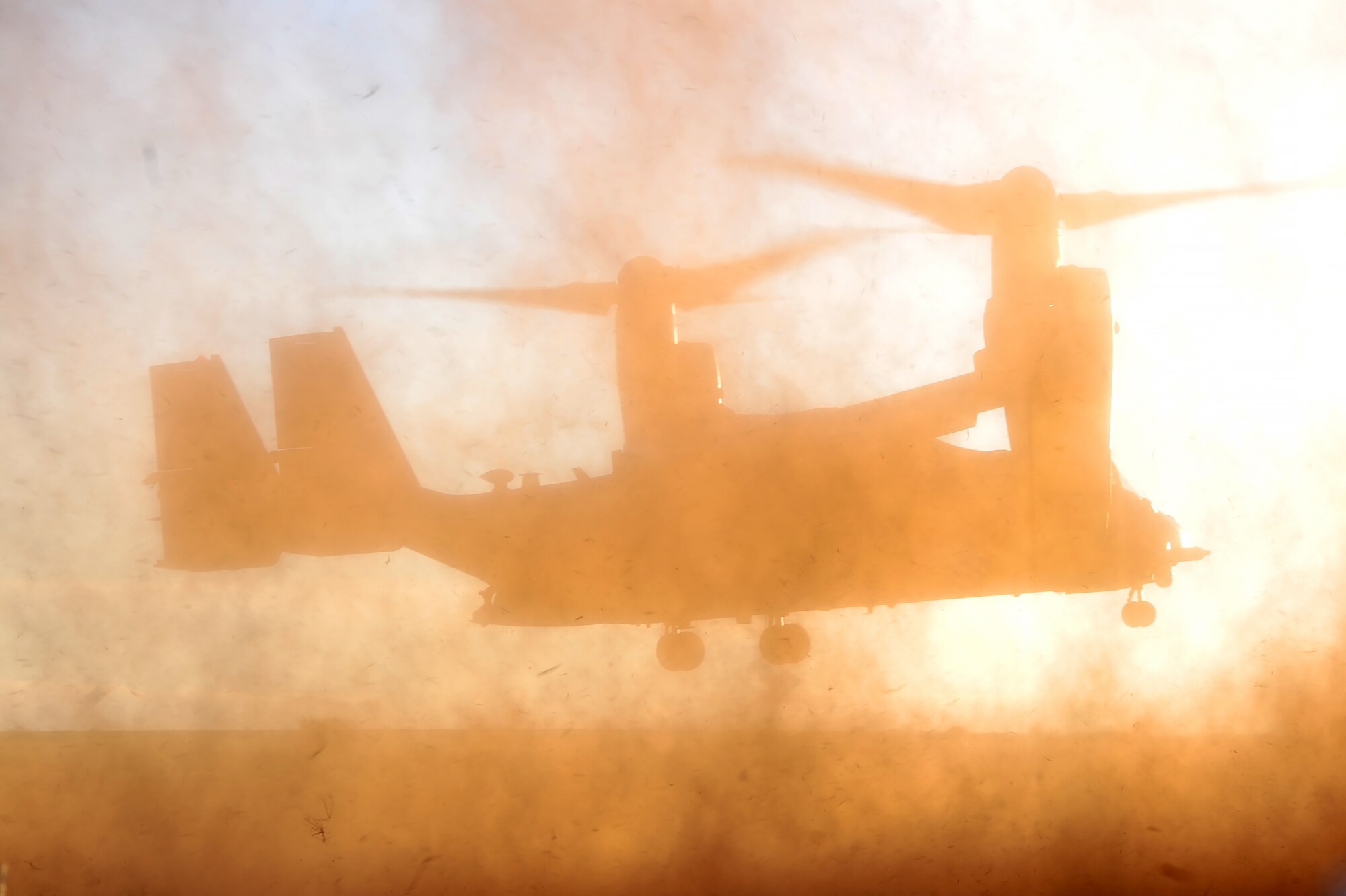 Aircrew members assigned to the 20th Special Operations Squadron prepare to land a CV-22 Osprey Jan. 7, 2016, at Melrose Air Force Range, N.M. The aircraft landed to pick up Command Sgt. Maj. William Thetford, the U.S. Special Operations Command senior enlisted adviser, during his visit to Cannon Air Force Base, N.M. (U.S. Air Force photo/Tech. Sgt. Manuel Martinez)